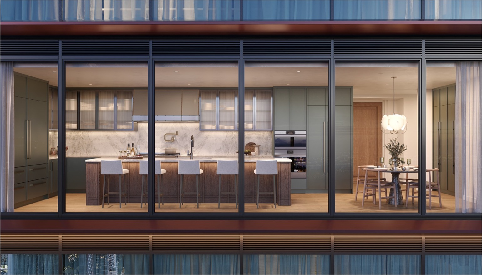 Mario Carbone chef's kitchen at Villa Miami — CornuFé dual-fuel range, Taj Mahal quartzite, fluted glass Italian cabinetry, Wolf and Sub-Zero appliances.